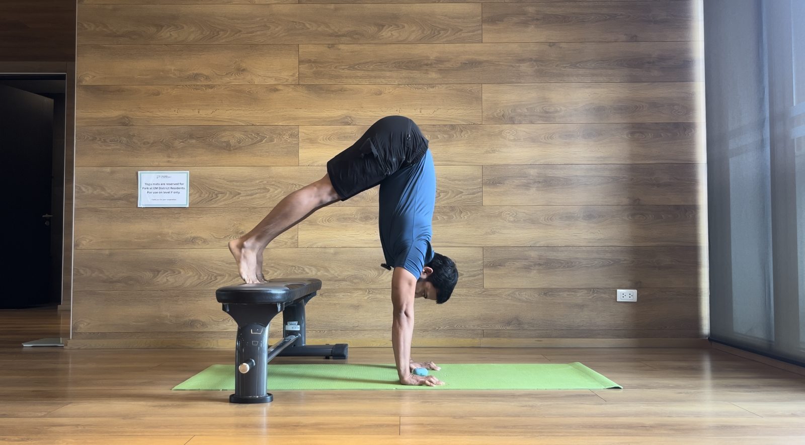 Pike handstand with feet on a bench